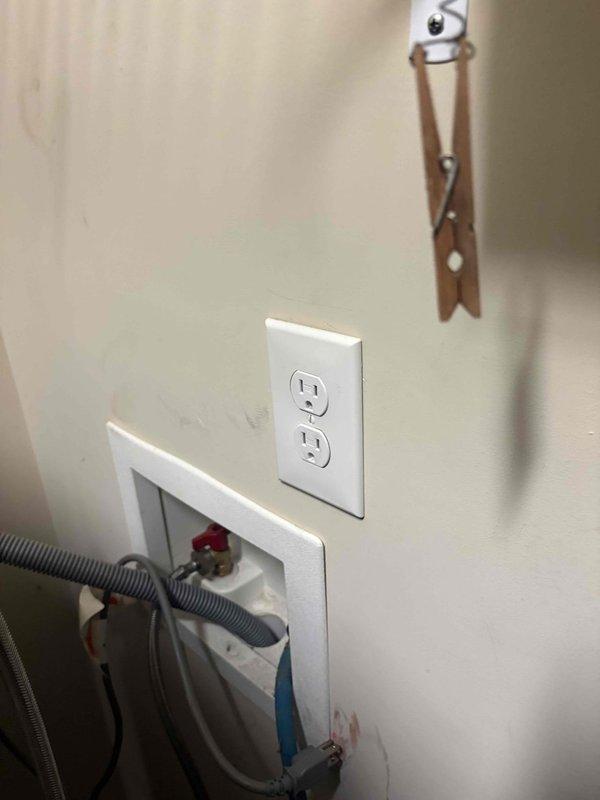 Completed comprehensive 32-point electrical system evaluation on 2014 home. Performed electrical panel maintenance including proper torquing of all breaker connections and verification of secure terminations at main breaker and branch circuits. Tested all GFCI shock protection outlets and breakers to confirm proper ground fault protection functionality. Verified operation of all AFCI fire protection breakers to ensure arc fault detection systems working correctly. Conducted smoke and carbon monoxide detector maintenance including battery replacement and alarm testing. Replaced customer-supplied light bulbs in fixtures up to 12 feet. Cleaned ceiling fans up to 12 feet in height. Documented electrical panel configuration showing main service entrance conductors, split-bus breaker arrangement, and proper neutral and ground bus bar connections. Inspected laundry room electrical outlet and washing machine water supply box installation. All electrical systems tested and confirmed operational