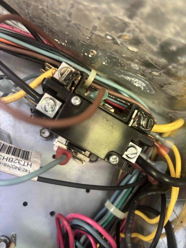 Responded to no cooling complaint on 10+ year old system. Found supply air temperature at 65.3°F, confirming inadequate cooling with indoor temperature at 80°F. Inspected outdoor unit contactor and electrical connections, which showed proper wire terminations and organization. Diagnosed system failure preventing proper refrigeration cycle operation, resulting in air handler circulating unconditioned air only.