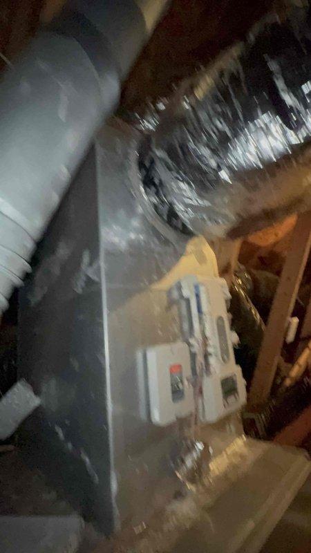Responded to no cooling complaint affecting rear portion of residence. Found inadequate airflow to back zones while front and upstairs areas maintained proper air delivery. Performed static pressure diagnostics on air handler unit using digital manometer, recording 0.74" measurement. Inspected ductwork system and air handler located in basement area. Identified zoning system issue affecting one of three thermostats controlling the property. Verified proper operation of equipment and supply duct connections at main unit.