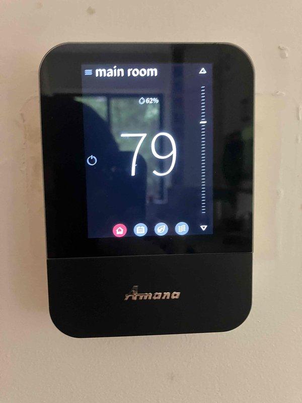 Responded to no cooling complaint on recently installed Amana air handler system with error code displayed on thermostat. Upon arrival, found unit in error state with indoor temperature reading 79°F and 62% humidity. Investigated air handler malfunction, accessed system diagnostics through Amana touchscreen thermostat, and identified potential recall-related component issue affecting unit operation. Documented system settings and current operating conditions for warranty and recall verification purposes.