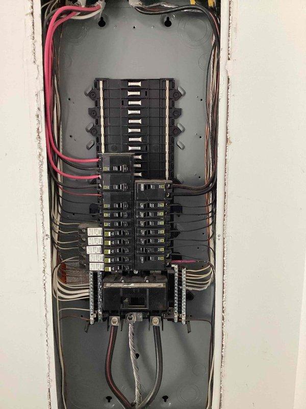 Responded to non-functioning switches in garage of 2018 home. Inspected electrical panel and identified tripped GFCI circuit affecting two garage switches. Reset GFCI receptacle, verified proper circuit protection at main panel, and tested both switches to confirm restored functionality and proper grounding.