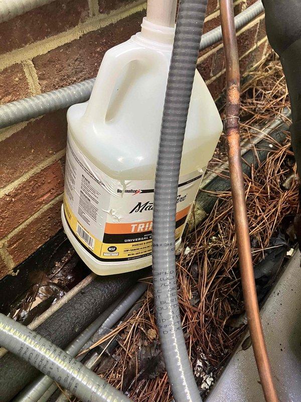 Performed follow-up inspection on 2-month-old HVAC system to assess condensate drain line discharge volume and verify proper system operation. Inspected drain line terminus at exterior unit, confirmed adequate drainage flow with no blockages or restrictions present. Applied MasterCare TRIPLE-D universal coil cleaner to condenser coils to maintain optimal heat transfer efficiency and prevent future drainage issues caused by debris accumulation.