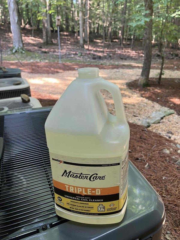 Performed follow-up inspection on 2-month-old HVAC system to assess condensate drain line discharge volume and verify proper system operation. Inspected drain line terminus at exterior unit, confirmed adequate drainage flow with no blockages or restrictions present. Applied MasterCare TRIPLE-D universal coil cleaner to condenser coils to maintain optimal heat transfer efficiency and prevent future drainage issues caused by debris accumulation.