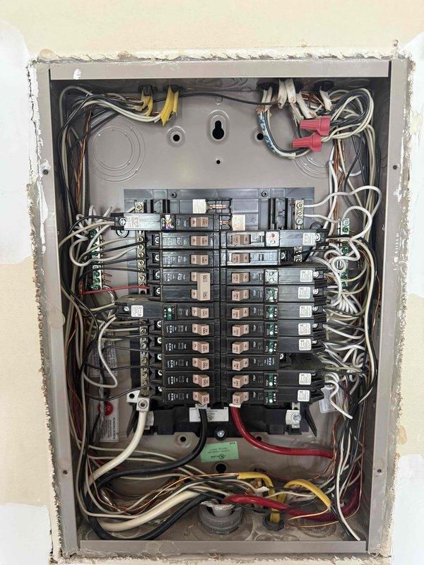 Responded to service call for non-functioning closet lights in bedroom of 2019-built home. Performed electrical system inspection and accessed main electrical panel to diagnose circuit issues affecting the bedroom closet lighting fixtures. Inspected panel wiring connections, circuit breaker configuration, and verified proper terminations at main lugs and distribution bars. Tested circuit continuity and restored power to affected lighting circuits serving the 8-foot ceiling-mounted closet fixtures.