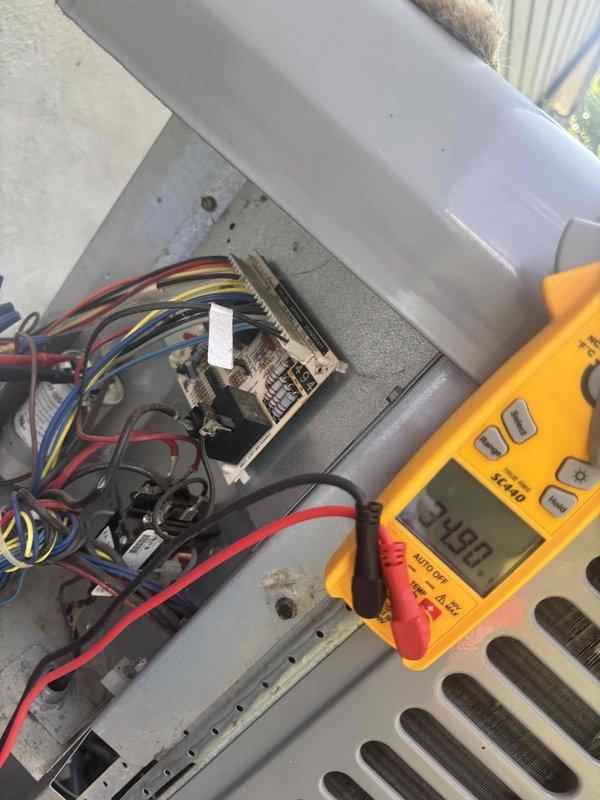 Completed comprehensive heating and air maintenance on 7-year-old system including full 80-point inspection on all units. Performed outdoor coil cleaning, burner cleaning, and adjusted gas pressures to manufacturer specifications. Conducted electrical diagnostics on outdoor unit control panel, verifying proper voltage readings of 24.9V at control circuit and checking capacitor performance with multimeter showing 9.05 reading. All safety inspections passed and system operating within normal parameters.