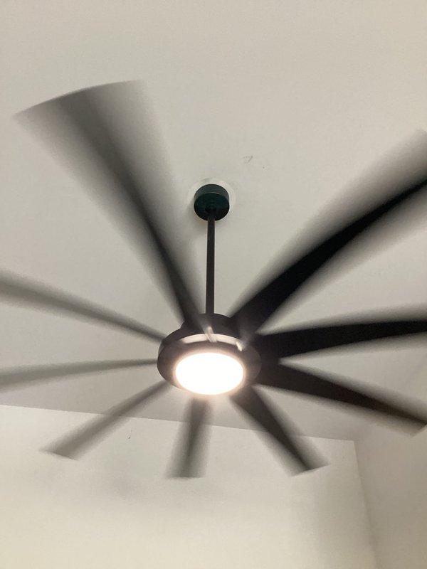 Replaced existing recessed lighting with two ceiling fan fixtures in a residential garage with 11-12 foot ceilings. Provided sizing recommendations for appropriate fixtures given the ceiling height, installed fan units with integrated LED lighting, and verified proper electrical connections at the panel to ensure safe operation of the new fixtures.