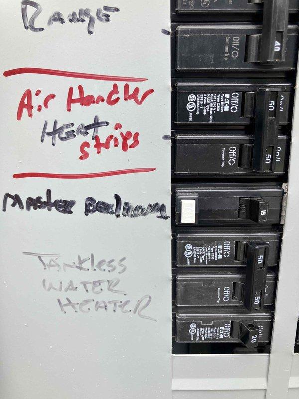 Responded to a return visit following reports of a bedroom/bathroom circuit breaker tripping twice after initial installation. Performed comprehensive electrical panel upgrade and circuit corrections including installation of properly sized UL-listed breakers in main panel, removal of abandoned hot tub wiring, and installation of two bedroom switches. Added GFCI protection to kitchen countertop outlets and master bathroom circuits per code requirements. Installed switch plates and fire-rated outlet rings for television location and attic access point. Corrected water heater panel entry with proper strain relief connector. Updated and verified circuit panel labeling for all affected circuits including range, air handler with heat strips, tankless water heater, kitchen circuits, master bedroom, and bathroom GFCI protection. All circuits tested and operating correctly upon completion with no further tripping issues observed.