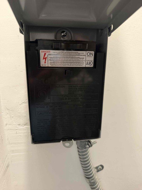 Responded to service call for 9-year-old single-system HVAC unit reported to be blowing warm air. Performed diagnostic inspection of vertical air handler unit and associated electrical components, including disconnect box and safety controls. Documented equipment condition with photos of unit installation, refrigerant lines, condensate drainage, air filtration, and electrical connections for system quote preparation.