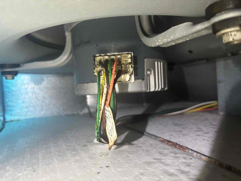Responded to service call for unusual sounds from second floor air conditioning system. Upon inspection, discovered excessive frost buildup on blower wheel assembly and deteriorated electrical connections with visible corrosion on wire terminals. Documented conditions with photos showing compromised wiring insulation and uniform frost coating across centrifugal fan blades, indicating potential refrigerant flow issues or airflow restrictions requiring further diagnostic evaluation and repair.