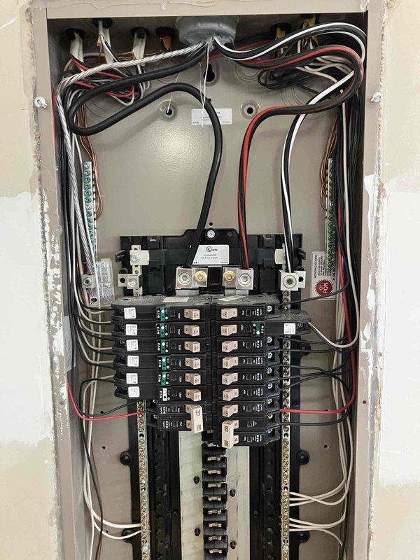 Completed annual 32-point electrical system evaluation on residential property. Performed comprehensive electrical panel maintenance including torque verification and inspection of all circuit breaker connections at main service panel. Tested all GFCI and shock protection outlets and breakers to confirm proper ground fault protection functionality. Conducted arc fault circuit interrupter breaker testing to verify fire protection systems operating within specifications. Performed smoke and carbon monoxide detector maintenance including battery replacement and operational testing of all units. Replaced customer-supplied light bulbs in fixtures up to 12 feet and cleaned ceiling fans up to 12 feet. All electrical systems found to be functioning properly with no deficiencies noted.