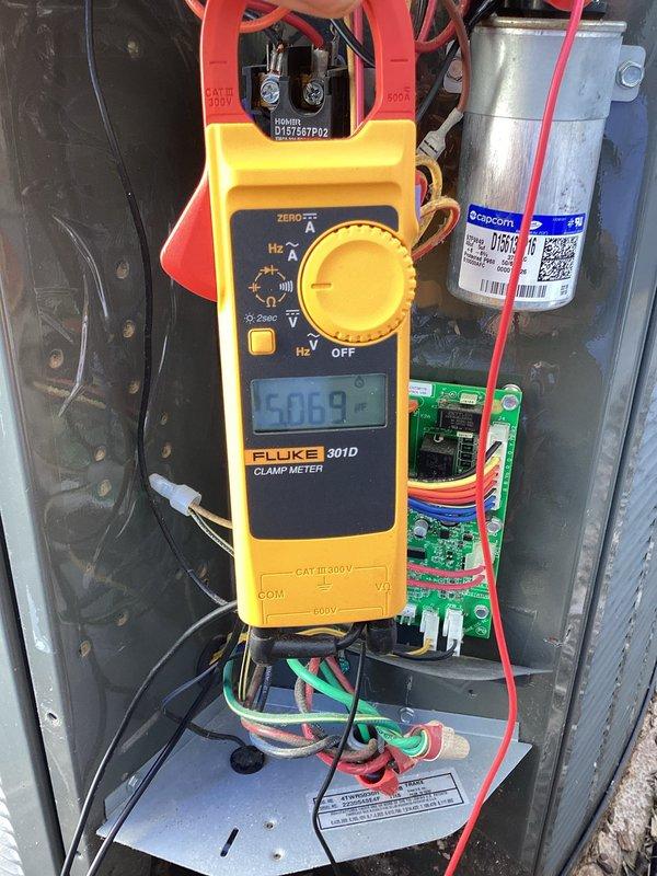Completed comprehensive spring preventive maintenance on HVAC system including full 80-point inspection of heating and cooling equipment. Performed outdoor coil cleaning, burner cleaning, gas pressure adjustments, and thorough safety inspections. Verified electrical connections at service disconnect, tested and documented system amperage readings at 5.069 amps using calibrated instrumentation, and confirmed proper capacitor operation to ensure optimal system performance and reliability.