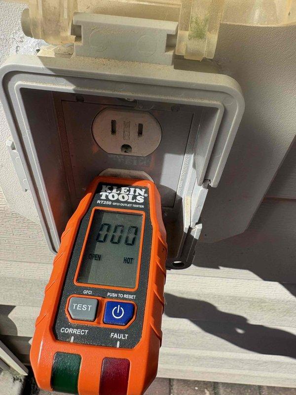 Responded to non-functioning exterior GFCI outlet that lost power after potential water exposure from rain while cord was plugged in. Tested exterior outlet with Klein RT250 GFCI tester and confirmed no power; verified main breaker was not tripped. Located and tested upstream interior GFCI outlet which had tripped, successfully reset the device, restoring power to the exterior outlet and confirming proper GFCI protection throughout the circuit.