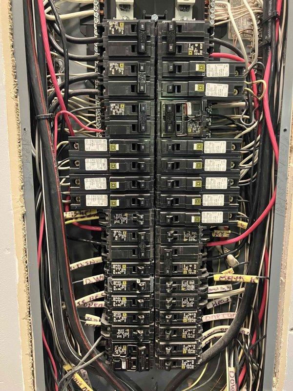 Completed comprehensive electrical safety evaluation of 2013 residential system to diagnose multiple non-functioning outlets and assess overall electrical infrastructure. Performed detailed inspection of main electrical panel, verifying breaker integrity, wire connections, and circuit labeling; documented current panel configuration with organized wire routing along dual breaker columns. Evaluated receptacle circuits throughout home to identify power loss issues and assessed panel capacity for potential future breaker box upgrade to meet enhanced electrical demands.