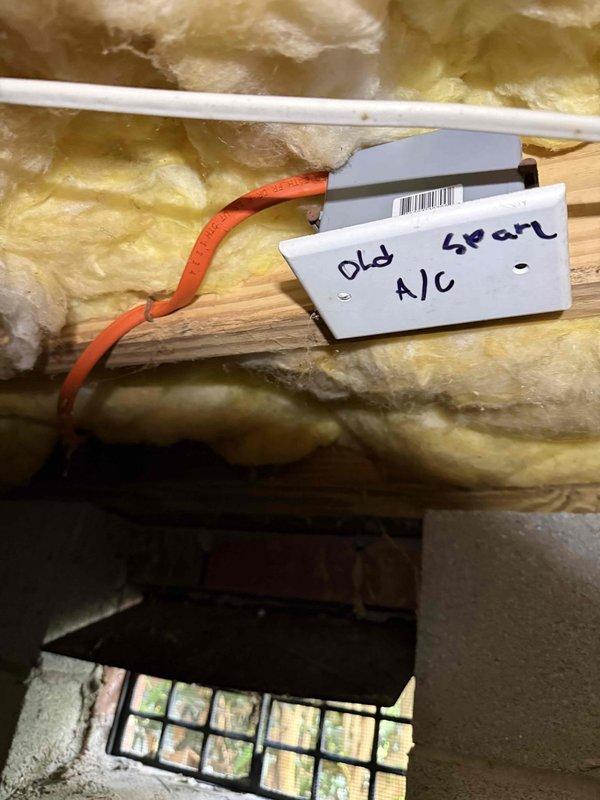 Installed dedicated electrical circuit for HVAC air conditioning unit, routing new wiring through attic space to exterior disconnect location. Verified proper voltage at 242V and confirmed all connections were secure and operational.