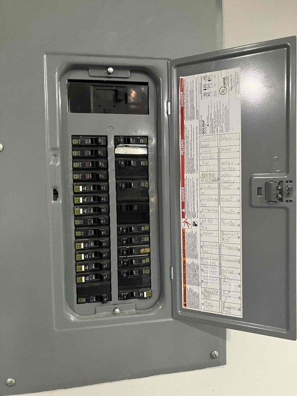 Responded to a tripped circuit breaker affecting basement receptacle circuits in a 2023 home. Upon arrival, inspected main electrical panel and confirmed the basement receptacle circuit breaker had been reset by homeowner after tripping due to overload conditions. Evaluated circuit loading and panel configuration, documented electrical system with photographs of exterior meter base and main distribution panel. Advised homeowner on proper load management for the affected circuit and recommended monitoring usage to prevent future nuisance tripping, with potential circuit expansion or rewiring options discussed if overloading continues.