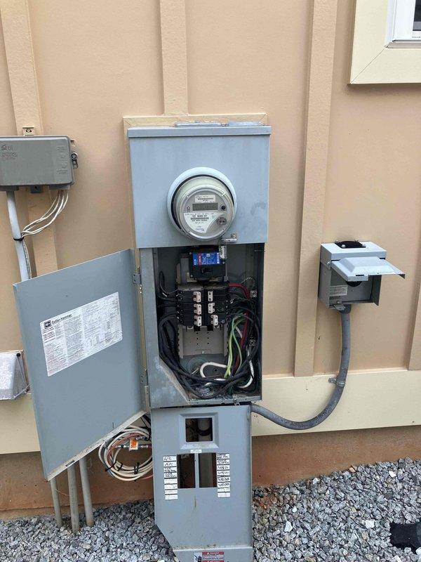 Completed whole home generator consultation at 2013 residential property with existing 500-gallon propane tank on-site. Evaluated current electrical service panel configuration, meter installation, and existing utility infrastructure to determine generator integration requirements. Assessed propane fuel supply capacity and documented electrical panel layout including circuit breaker configuration and available connection points for standby generator installation.