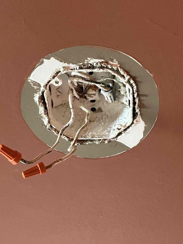 Responded to tripped GFCI outlet on front porch that failed to reset after moisture intrusion from misting activity. Diagnosed and replaced faulty GFCI receptacle in weatherproof exterior box mounted on brick wall, restoring power to protected circuit. Additionally, removed existing ceiling fan with broken pull chain in bedroom and installed customer-supplied replacement ceiling fan unit with remote control operation at standard ceiling height, completing all electrical connections and verifying proper functionality.