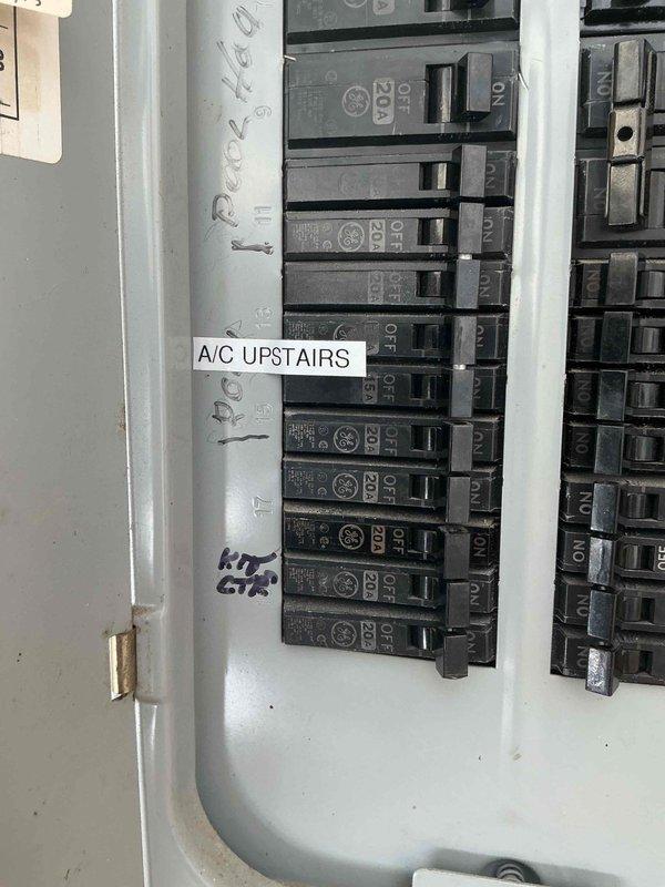 Completed electrical installation for upstairs air conditioning system. Installed dedicated 240V disconnect switch on exterior wall with proper labeling and conduit routing, and connected circuit breakers in main electrical panel with clear circuit identification for the new HVAC unit.