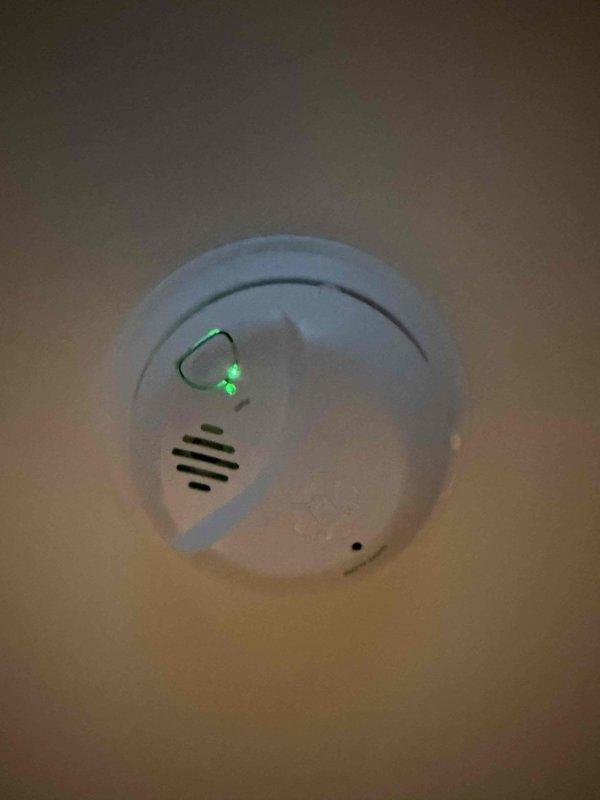Completed installation of two ceiling fans in residential property with 8-foot ceilings, mounting one unit in the family room and one in the bedroom. Installed two hardwired smoke detectors with battery backup on ceiling surfaces, verifying proper placement per code requirements and confirming operational status through test button activation and LED indicator verification. All devices tested and left in full working order upon completion.
