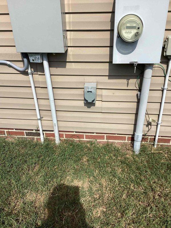 Installed generator power inlet box on exterior of residential property built in 2015. Ran PVC conduit from main electrical panel to new inlet box location on exterior wall near existing meter and service equipment. Made necessary connections at main panel to accommodate generator transfer capability. Verified all electrical connections were secure and installation met code requirements for generator hookup systems.