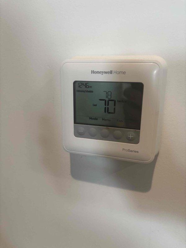 Completed comprehensive tune-up service on three HVAC systems, all approximately 3 years old. Performed standard maintenance procedures including system diagnostics, electrical measurements showing 39.05 reading on condensing unit, and verified proper thermostat operation with Honeywell ProSeries unit displaying correct cooling mode functionality at 73°F setpoint. All three systems inspected, tested, and confirmed operating within normal parameters.