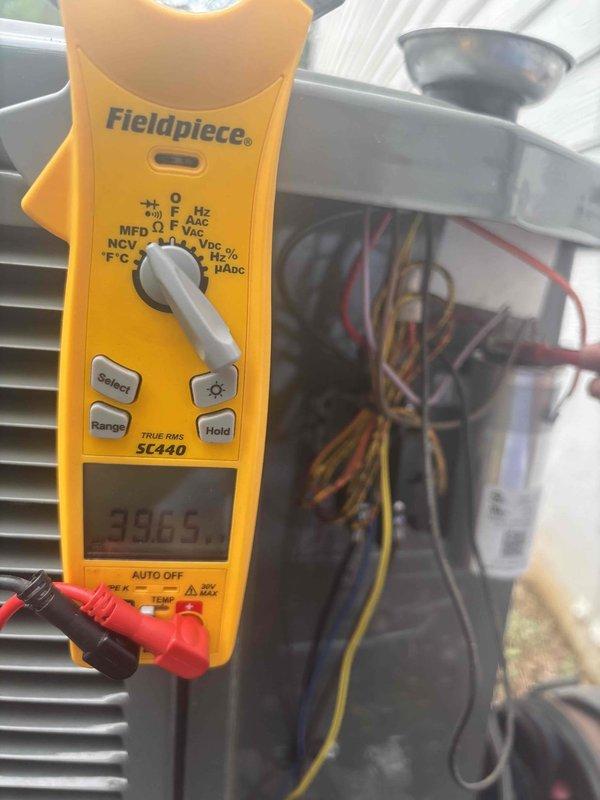 Completed comprehensive tune-up service on three HVAC systems, all approximately 3 years old. Performed standard maintenance procedures including system diagnostics, electrical measurements showing 39.05 reading on condensing unit, and verified proper thermostat operation with Honeywell ProSeries unit displaying correct cooling mode functionality at 73°F setpoint. All three systems inspected, tested, and confirmed operating within normal parameters.