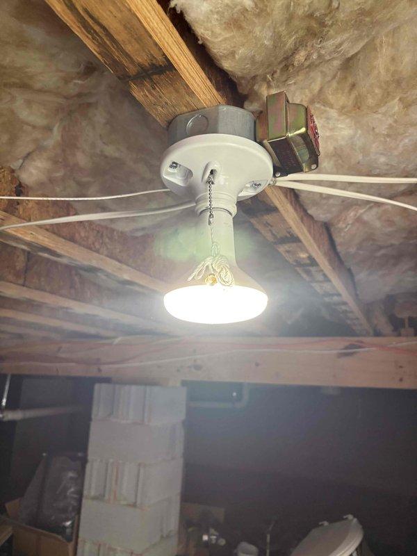 Responded to service call addressing multiple lighting issues throughout the residence. Evaluated three-way switch configuration for dimmer compatibility and provided recommendations for proper installation. Inspected laundry room light switch and assessed non-functional motion sensor light fixture that previous contractor was unable to repair. Investigated crawlspace lighting circuit to diagnose complete power loss and traced wiring to identify control method. Examined ceiling-mounted fixtures and attic/crawlspace electrical components to determine proper functionality and code compliance.