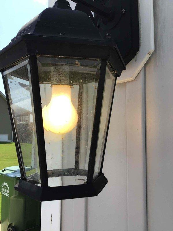 Responded to service call for exterior garage light fixture with stuck light bulb base remaining in socket after bulb failure. Successfully removed broken bulb remnant from lantern-style wall-mounted fixture and installed customer-provided replacement bulb, restoring proper operation. Verified fixture functionality and inspected electrical panel to ensure no underlying circuit issues contributed to bulb failure.
