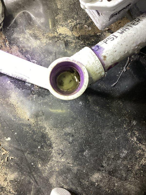 Responded to service call for thermostat displaying no signal error and water leakage from HVAC unit in crawlspace. Upon inspection, found condensate drain line issue with PVC piping showing signs of clogging or improper drainage, resulting in water discharge onto crawlspace floor. Assessed air handler unit and associated ductwork, noting deteriorated insulation in crawlspace that may require future attention but was not directly related to immediate water issue.