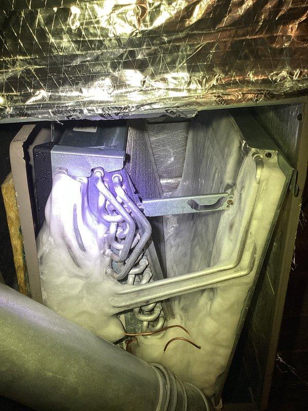 Responded to emergency after-hours call for non-operational air conditioning system. Upon arrival, discovered significant water accumulation in mechanical room surrounding air handler and condensate management equipment. Inspection revealed condensate pump failure causing drainage system malfunction and subsequent flooding of utility area. Accessed attic-mounted air handler unit and verified refrigerant lines and internal components for proper operation. Identified failed condensate pump as root cause preventing AC system operation due to safety float switch activation. Addressed immediate water intrusion issue and restored condensate drainage functionality to return system to operational status.