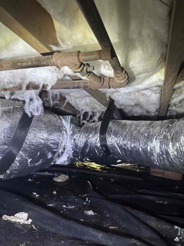 Completed residential ductwork replacement and enhancement for a 2.5 to 3 ton HVAC system in crawl space area. Installed new flexible ductwork with proper sealing and secured routing through existing infrastructure alongside copper piping and electrical systems. Enhanced system with air quality improvements including installation of Aprilaire 1110 media air cleaner, TRADEPRO TP-VC-UV24-PRO germicidal UVC light kit for microbial control, and Intermatic AG3000 HVAC surge protector (120/240 VAC, Type 4x enclosure) for equipment protection. All components installed per manufacturer specifications and integrated with existing HVAC system to optimize airflow distribution and indoor air quality.