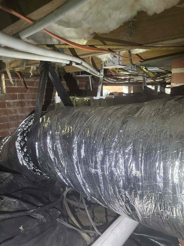 Completed residential ductwork replacement and enhancement for a 2.5 to 3 ton HVAC system in crawl space area. Installed new flexible ductwork with proper sealing and secured routing through existing infrastructure alongside copper piping and electrical systems. Enhanced system with air quality improvements including installation of Aprilaire 1110 media air cleaner, TRADEPRO TP-VC-UV24-PRO germicidal UVC light kit for microbial control, and Intermatic AG3000 HVAC surge protector (120/240 VAC, Type 4x enclosure) for equipment protection. All components installed per manufacturer specifications and integrated with existing HVAC system to optimize airflow distribution and indoor air quality.