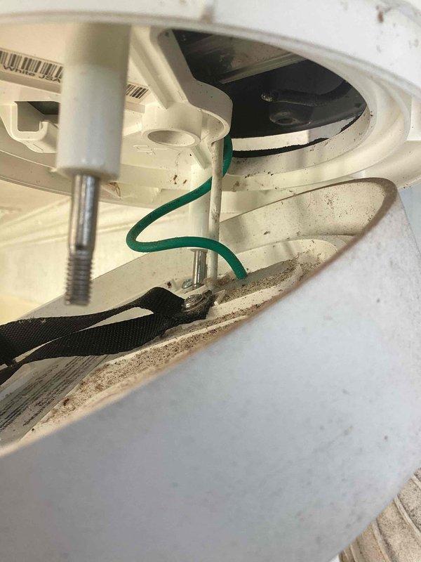 Responded to no-power issue with Ring floodlight camera mounted on first-floor exterior. Inspected electrical panel and identified tripped breaker supplying power to the fixture circuit. Accessed ceiling-mounted junction box and fixture housing, finding loose wire connection at the ground terminal and compromised hot wire connection due to dust accumulation and vibration over time. Cleaned electrical connections, re-terminated all wiring securely, verified proper grounding, reset circuit breaker, and confirmed floodlight camera restored to full operation.