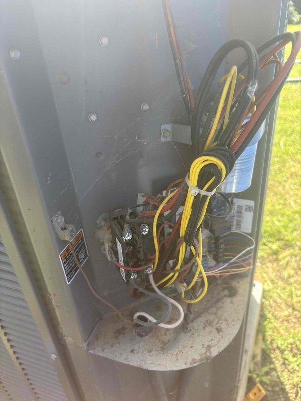 Responded to emergency service call for attic HVAC unit experiencing water leakage into living space. Upon arrival, met with family members on-site and conducted diagnostic inspection of 5-6 year old system. Accessed outdoor unit electrical compartment and performed multimeter testing to assess system operation and identify source of water intrusion. System had been shut down prior to arrival per emergency protocols to prevent further water damage to residence.