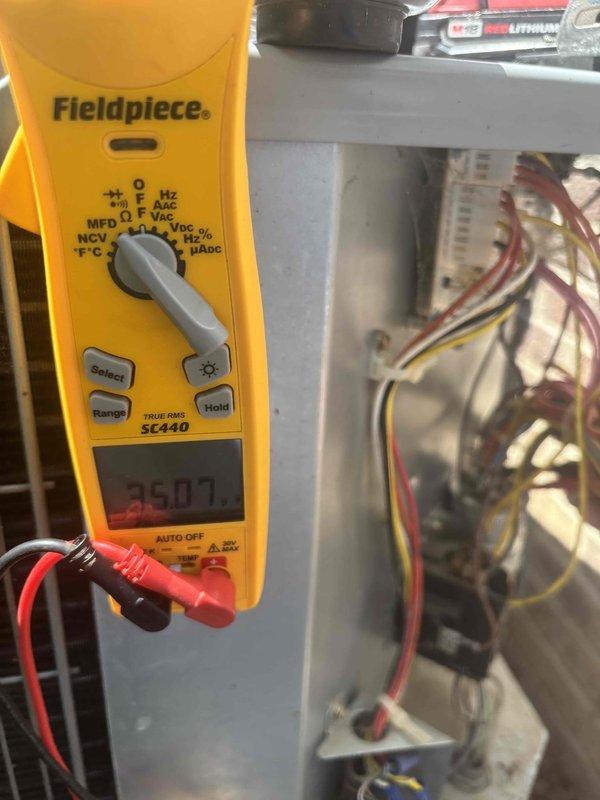 Responded to no cooling complaint on 2019 residential AC system with thermostat indicating possible compressor failure. Upon arrival, performed comprehensive system diagnostics including electrical testing at control panel using digital multimeter, which revealed voltage reading of 250.7V. Accessed attic-mounted air handler and ductwork to inspect system components, wiring connections, and operational status. Evaluated compressor functionality, refrigerant circuit, and all electrical connections throughout the system. Documented equipment conditions and electrical measurements to determine root cause of cooling failure and provided homeowner with repair options and recommendations to restore system operation.