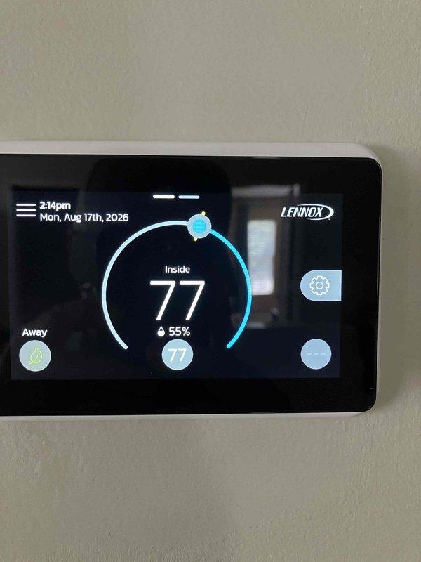 Responded to warranty callback for loud noise complaint on Lennox system. Upon arrival, verified thermostat was operating normally and displaying proper temperature readings of 77°F with 55% humidity. Conducted sound level testing using calibrated decibel meter at system location, measuring average noise levels of 66.2 dBA with maximum readings reaching 67.6 dBA. Documented current operating conditions with photos of thermostat display and sound measurements for warranty claim processing.