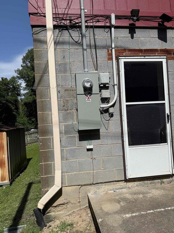 Completed installation of 200 amp meter panel combination unit with new circuit breakers and connections on exterior wall. Installed main grounding system and water bonding to meet current electrical code requirements. Coordinated permits with inspection department and power company, completing reconnection and disconnect procedures as specified.