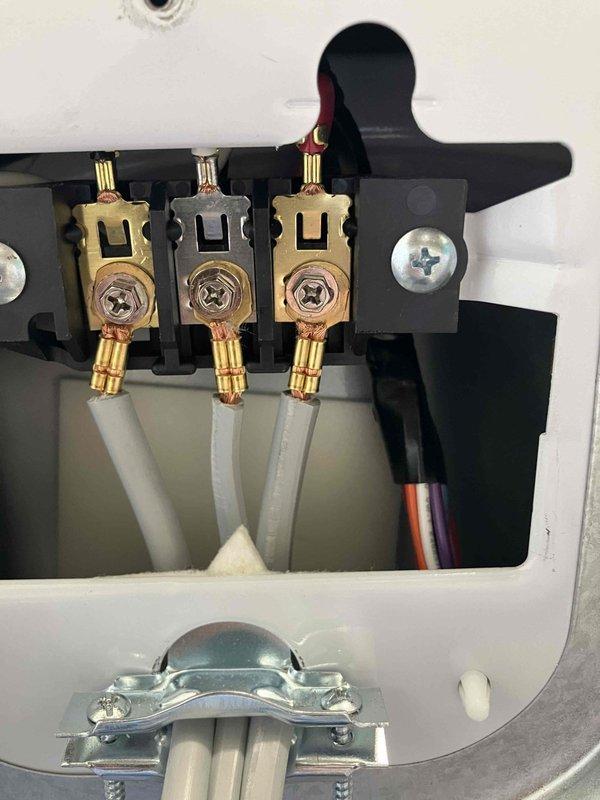 Responded to a dryer power issue where the appliance would run for 3 seconds before shutting off and tripping the breaker. Inspected the dryer receptacle and terminal connections, finding compromised wiring at both the wall outlet and the terminal block. Identified loose or damaged connections at the brass terminal screws and deteriorated conductor ends that were causing intermittent shorts and overcurrent conditions. Replaced the defective receptacle, re-terminated all conductors with proper torque specifications, and verified secure connections at the terminal block. Tested the circuit under load to confirm proper operation without breaker trips, restoring full functionality to the dryer circuit.