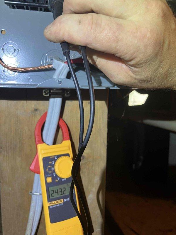 Responded to a power outage in the living room that occurred following a lightning storm several weeks prior. Upon arrival, performed electrical diagnostics using a clamp meter to measure current and voltage at affected circuits. Identified damaged wiring and compromised electrical connections at outlet and panel locations. Inspected terminal blocks and wire connections, finding evidence of electrical stress consistent with lightning surge damage. Replaced faulty outlet, repaired damaged wiring, and secured all electrical connections to restore power to the living room circuit. Verified proper voltage readings and confirmed all affected outlets and circuits were functioning safely before completing the service call.