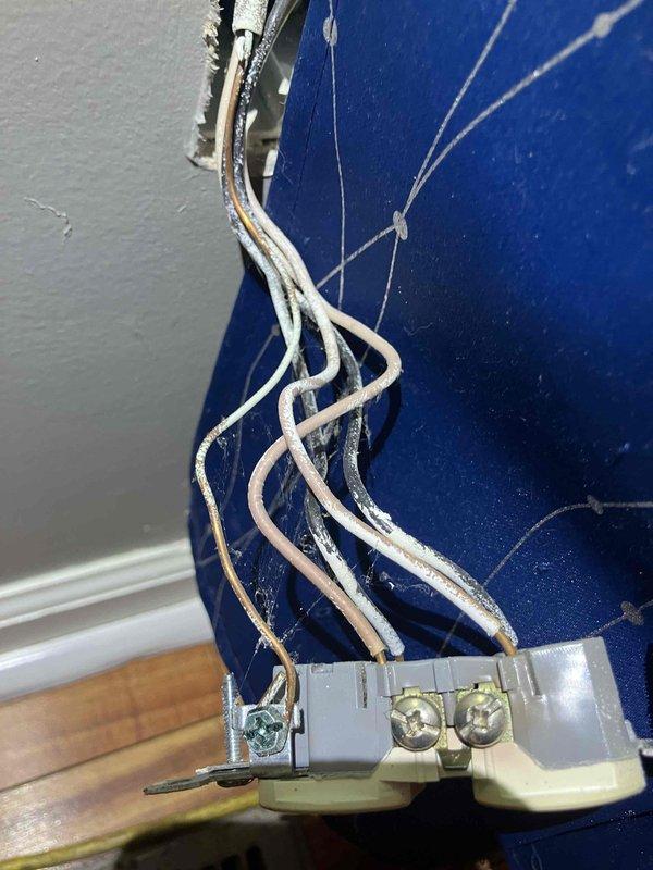 Responded to a power outage in the living room that occurred following a lightning storm several weeks prior. Upon arrival, performed electrical diagnostics using a clamp meter to measure current and voltage at affected circuits. Identified damaged wiring and compromised electrical connections at outlet and panel locations. Inspected terminal blocks and wire connections, finding evidence of electrical stress consistent with lightning surge damage. Replaced faulty outlet, repaired damaged wiring, and secured all electrical connections to restore power to the living room circuit. Verified proper voltage readings and confirmed all affected outlets and circuits were functioning safely before completing the service call.