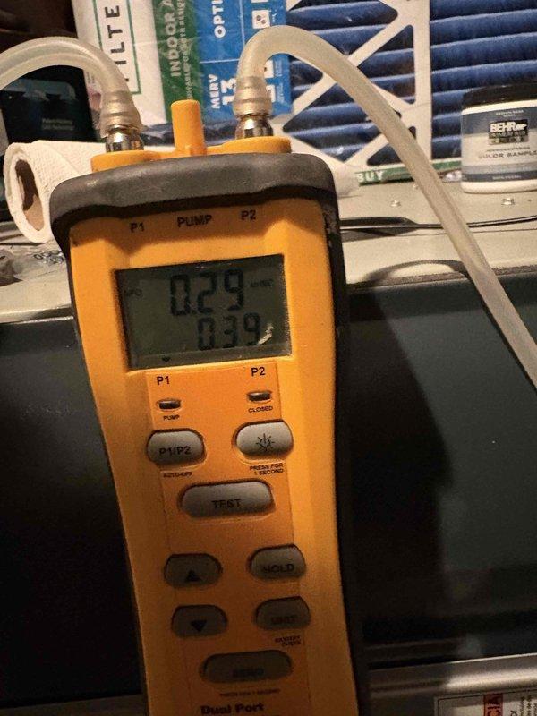 Performed comprehensive system evaluation on two HVAC units (4-year-old upstairs system and 10-year-old system) at customer's request for second opinion. Conducted diagnostic testing using dual port manometer to measure static pressure readings across both systems, verifying airflow performance and system operation. Documented findings with diagnostic measurements and visual inspection of equipment components.
