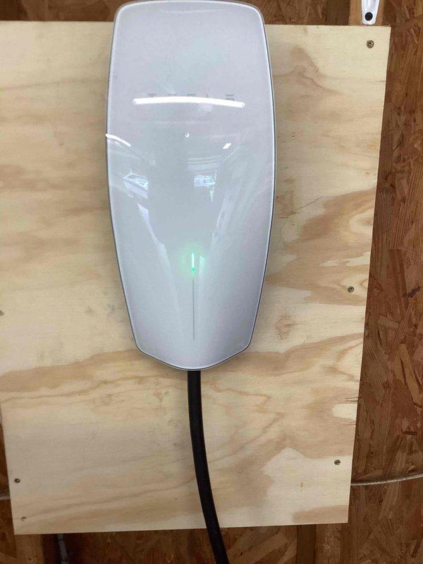 Relocated existing EV charger to opposite side of garage, including disconnection from original location, running new dedicated circuit wiring through wall cavities, mounting charger unit on plywood backing secured to wall studs, and verifying proper operation with green indicator light functioning. Installed three new 120V outlets on rear patio area, running appropriate gauge wiring from electrical panel, mounting weather-resistant boxes and receptacles, and testing all circuits for proper voltage and grounding. All work completed to code with proper wire management and secure mounting of all electrical components.