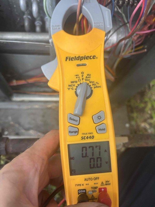 Responded to no cooling call at residential property. Upon arrival, performed electrical diagnostics on HVAC system using clamp meter. Measured compressor amperage at 11.09A and verified low voltage readings at 0.77V, indicating potential control circuit or transformer issues requiring further troubleshooting to restore cooling operation.