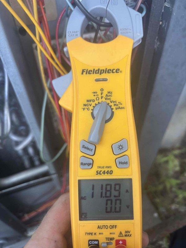 Responded to no cooling call at residential property. Upon arrival, performed electrical diagnostics on HVAC system using clamp meter. Measured compressor amperage at 11.09A and verified low voltage readings at 0.77V, indicating potential control circuit or transformer issues requiring further troubleshooting to restore cooling operation.