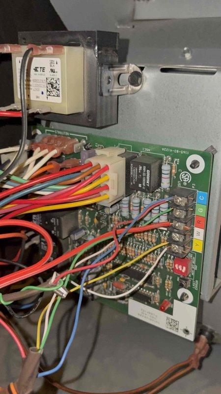 Responded to service call for continuously running blower fan on second and third floor zones when system was off. Upon inspection, found control board enclosure cover had been left off during previous service visit. Diagnosed issue as improper thermostat wiring configuration at the zone control panel causing constant call for fan operation. Corrected wiring connections at terminal block, verified proper relay operation on control board, and confirmed all wire terminations were secure. Reinstalled protective cover on control panel enclosure and tested system through multiple heating and cooling cycles to verify blower now operates only on demand and shuts off properly with thermostat.