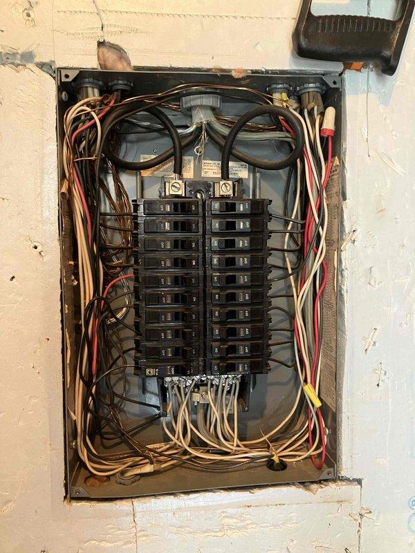 Responded to electrical issue in living room where TV outlet failed causing connected devices to lose power, including fireplace. Inspected electrical panel and verified breaker operation. Diagnosed and addressed secondary outlet with obstructed receptacle preventing plug insertion.