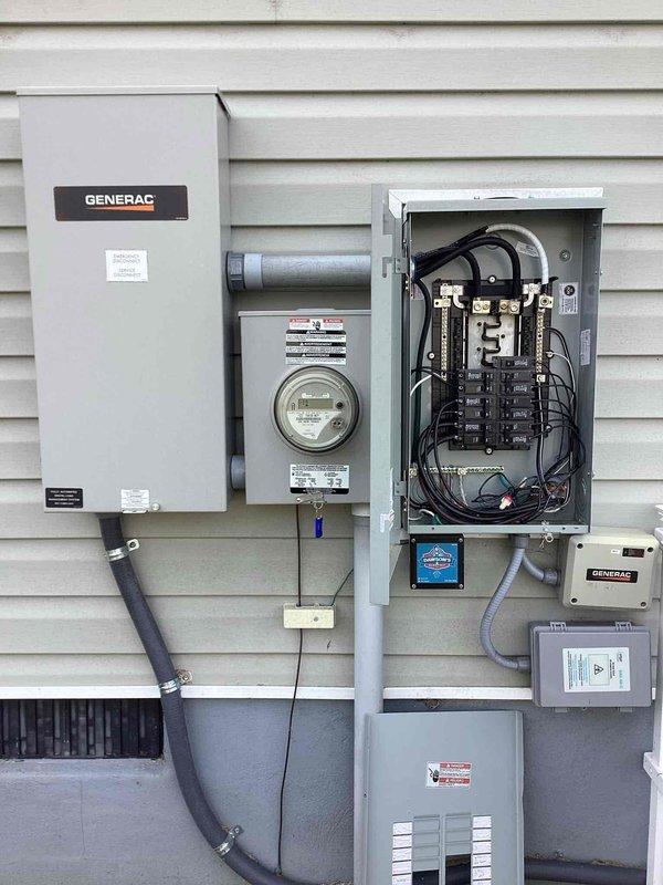 Completed annual 32-point electrical system evaluation including comprehensive electrical panel maintenance with torque verification and connection inspection of all breakers and bus bars. Performed GFCI outlet and breaker testing to verify proper shock protection functionality, along with arc fault breaker testing to ensure fire protection systems operating correctly. Conducted smoke and carbon monoxide detector maintenance including battery replacement and operational testing. Addressed reported concern regarding garage outlet pushed back into wall cavity; inspected recessed outlet installation and verified secure mounting and proper electrical connections. Inspected exterior electrical service equipment including main panel, meter base, and backup generator transfer equipment. Provided customer-supplied light bulb replacement service for fixtures up to 12 feet and performed ceiling fan cleaning service. All electrical systems tested and confirmed operational, with panel connections 