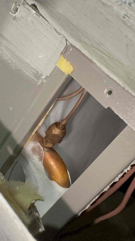 Responded to no cooling complaint on 5-year-old air conditioning system. Performed diagnostic testing using digital multimeter to check electrical components and voltage readings. Accessed interior components through ceiling panel to inspect refrigerant lines and electrical connections, identifying issue preventing proper system operation.