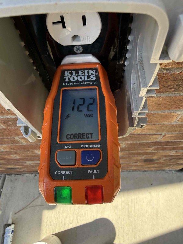 Responded to possible recall for non-functioning 120-volt exterior outlet installed during previous service upgrade. Upon arrival, tested outlet with Klein RT250 GFCI tester which displayed 122 VAC and "CORRECT" reading, confirming proper voltage and functionality. Provided customer education on locating the appropriate circuit breaker in the recently installed 200-amp service panel and explained panel operation procedures for future reference.
