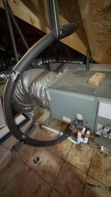 Responded to no cooling complaint on upstairs air conditioning system in a two-system residence with 10-year-old equipment. Accessed attic-mounted air handler and performed diagnostic testing of electrical components using digital multimeter, which revealed capacitor reading of 3366 on testing meter. Identified failed capacitor as root cause of cooling failure and completed necessary repairs to restore proper system operation.